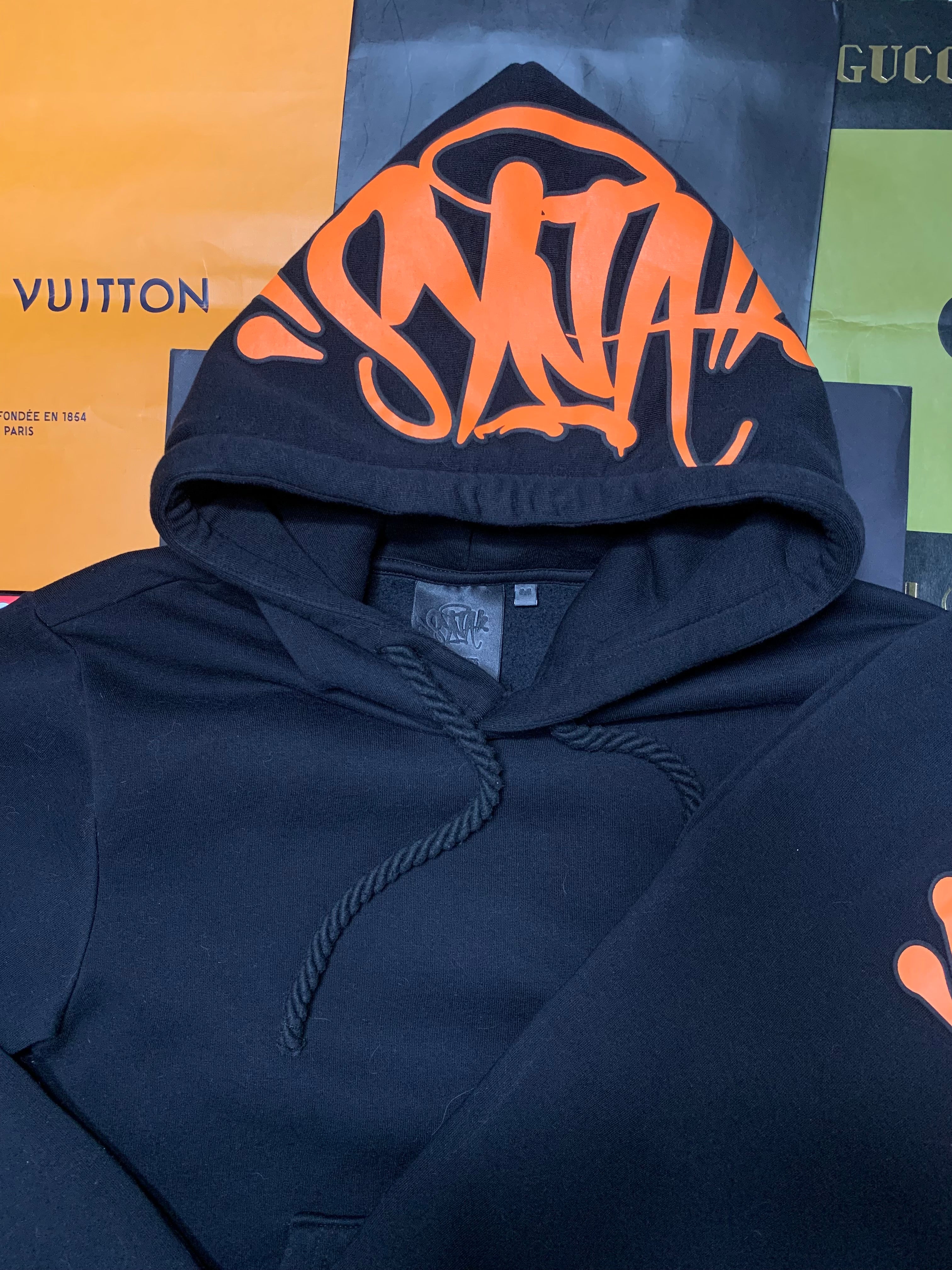 Syna world tracksuit orange/black